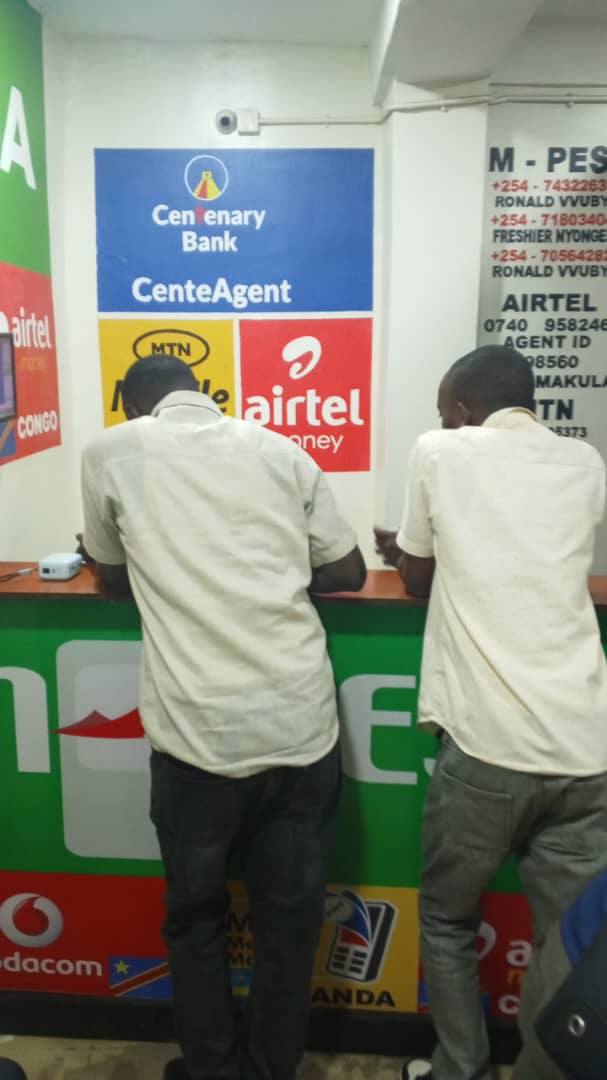 Customers being served at the Zotex agent banking counter